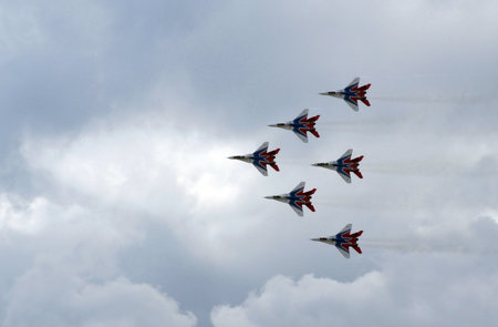 MiG-29 fighters over the Myachkovo airfield Performance of the Swifts aerobatic team on the...