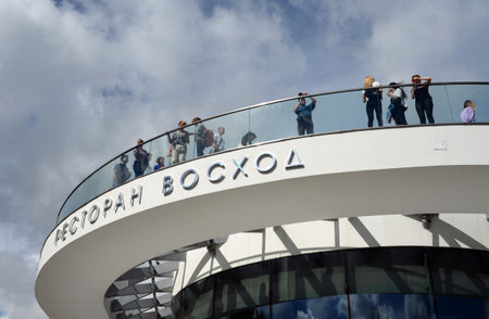 People on the viewing platform of the restaurant Sunrise in the landscape landscape park Zaryadye in...