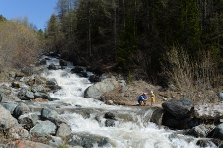 Tourists on the mountain river Yarlyamry. Altai republicのeditorial素材
