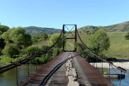 The old bridge over the Inu river near the village of Chineta in the Altai Territory