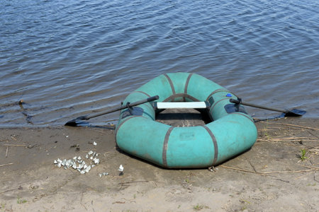 Rubber boat on the shore of Lake Krasilovo in the Altai Territory