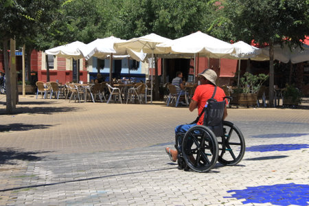 Unknown man in a wheelchair on Alameda streetのeditorial素材