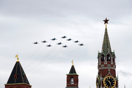 Tactical wing consisting of a group of Su-30SM and Su-35S fighters, and SU-34 bombers during a parade on the 75th anniversary of the Victory fly in the sky over Red Squareのeditorial素材