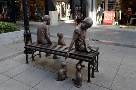 Sculptures of resting children with pets on the street of the coastal city of Marmaris. Turkeyのeditorial素材