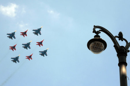 The flight groups "Swifts" and "Russian knights" on su-30 SM and MiG-29 aircraft in the sky over Moscow during the dress rehearsal of the Victory paradeのeditorial素材