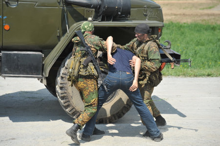 Soldiers of a special purpose unit are working on a military training ground to capture a truck