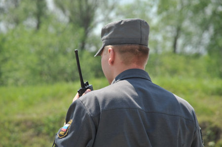 The policeman is talking on the radioのeditorial素材