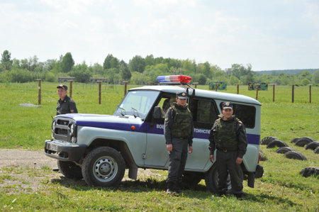 Military traffic police officers control traffic on the field roadのeditorial素材