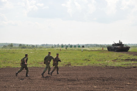 Russian tank soldiers work out the coherence of actions at the training ground in western siberiaのeditorial素材