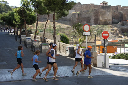 Athletes run along the street of the Spanish city of Malagaのeditorial素材