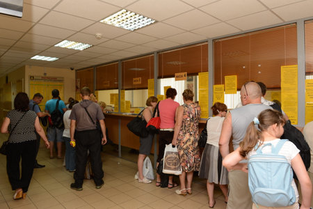 People stand in line at the ticket office of the bus station for tickets for intercity buses in Moscowのeditorial素材