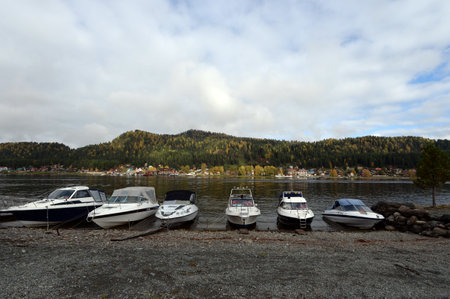 The boat sank on the shore of Lake Teletskoye in the village of Iogach. Altai republicのeditorial素材