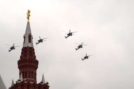 The Golden Eagles aerobatic team on Mi-28N attack helicopters in the sky over Moscow's Red Square during the Victory Air Paradeのeditorial素材