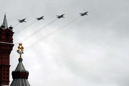 Modernized front-line bombers with a variable sweep wing Su-24M in the sky over Moscow's Red Square...