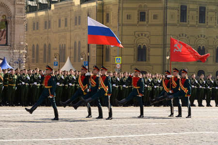 Servicemen of the honor guard company of the separate commandant's regiment carry the Victory banner...