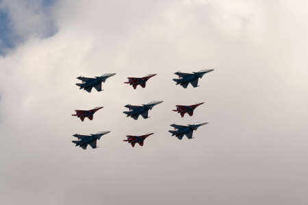 Aerobatic groups Swifts and Russian Knights on Su-30SM and MiG-29 aircraft in the sky over Moscow's...