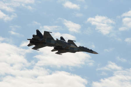 Russian two-seat twin-engined super maneuverable deck-mounted multi-purpose fighter Su-30 CM (Flanker-C) in the sky at the International Aviation Salon MAKS-2021のeditorial素材
