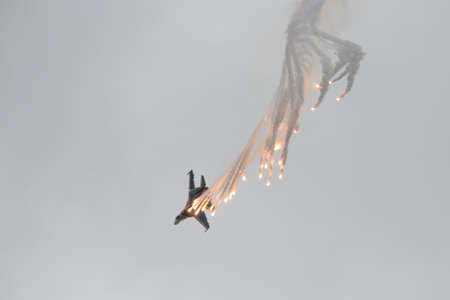 The SU-35S multi-purpose fighter from the Russian Knights aerobatics group is shooting false thermal targets at the MAKS-2021 International Aviation and Space Salonのeditorial素材