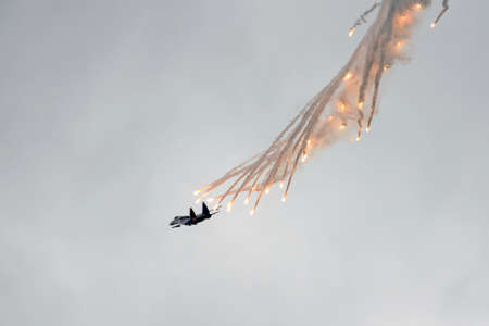 The SU-35S multifunctional fighter from the Russian Knights aerobatics group conducts shooting of false thermal targetsのeditorial素材