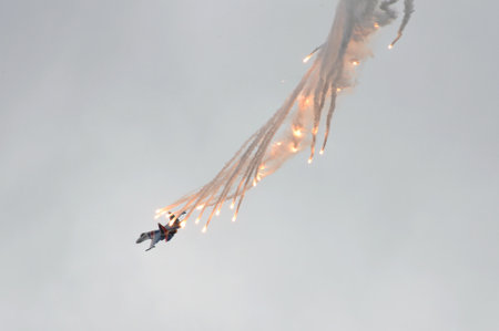 The SU-35S multifunctional fighter from the Russian Knights aerobatics group conducts shooting of false thermal targetsのeditorial素材