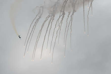 The SU-35S multifunctional fighter from the Russian Knights aerobatics group conducts shooting of false thermal targetsのeditorial素材
