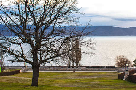 Relaxing autumn landscape - the park, the trees, the monument, the river の写真素材