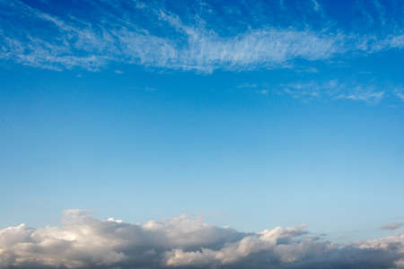 Beautiful blue sky with big clouds on the horizon and light Cirrus clouds.