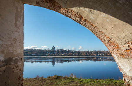 Old, thick, stone arch with views of the river Volga.の写真素材