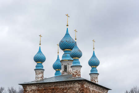 Blue Church domes with gold crosses on sky background.の写真素材