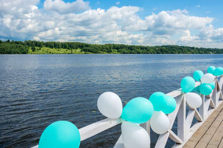 The embankment of the river Volga decorated with balloons on a Sunny day.の写真素材