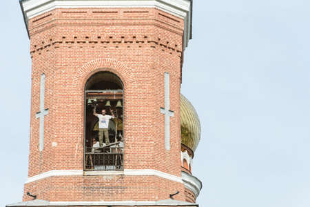 Playing the ringer on the high bell tower of red brick in Astrakhan, June 6, 2015.