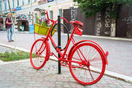 Red Bicycle on a narrow street in Astrakhan, June 6, 2015.のeditorial素材