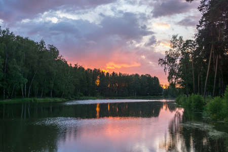 Colorful sunset on the Zaprudka in the town of Kokhma.の写真素材