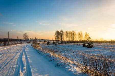 Sunset on a winter rural scene.の写真素材