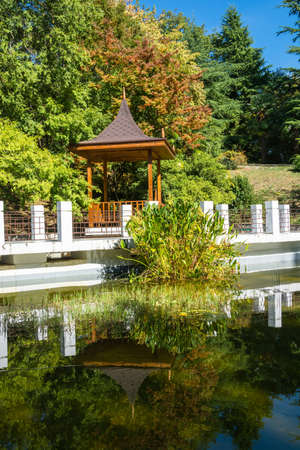 Beautiful gazebo and pond is framed by white stone in the Park-the arboretum of Sochi.の写真素材