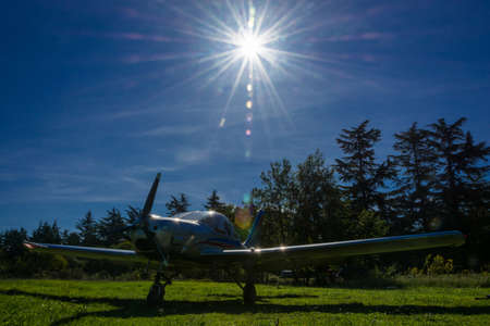 Single-engine plane on a small field on a Sunny day, Abkhazia.の写真素材