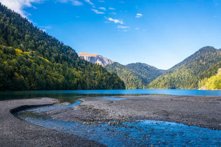 Mountain lake Ritsa in the autumn day, Abkhazia.の写真素材