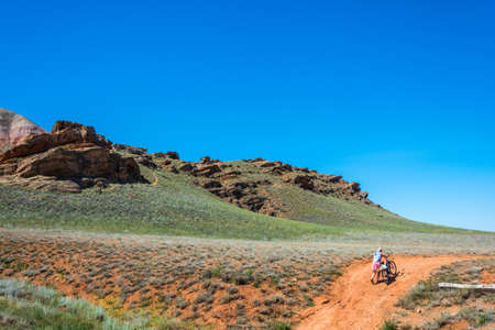 Biking on mount Big Bogdo, Nizhniy Baskunchak, Arkhangelsk oblast, Russia.の写真素材