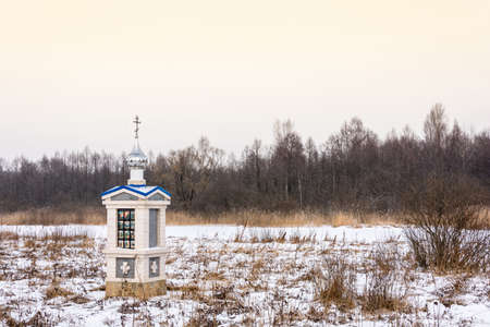 A small chapel on the way to the Holy spring of St. Tikhon of Lukh in a cloudy winter day, Timiryazevo village, Ivanovo region, Russia.の写真素材
