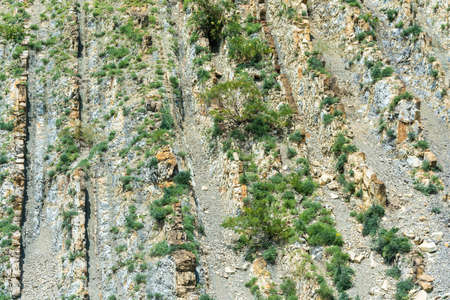 Texture steep, rocky mountains on a bright Sunny day.の写真素材