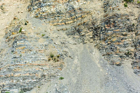 Texture steep, rocky mountains on a bright Sunny day.の写真素材