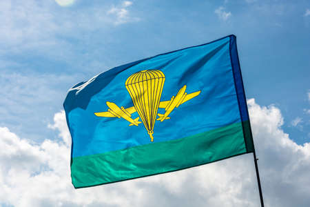Developing the flag of the Airborne troops of Russia on the background of cloudy sky.のeditorial素材