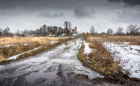 Rural road in a gloomy spring day in the Central part of Russia.の写真素材