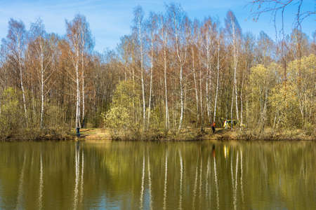 Ivanovo region, Russia - May 1, 2015: Holidaymakers on the shore small forest lakes, may 1, 2015, Ivanovo region, Russia.のeditorial素材