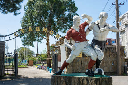 Gagra, Abkhazia â April 15, 2016: Old sculpture of two football players at the city stadium in Gagra, Abkhazia, 15 April, 2016.のeditorial素材