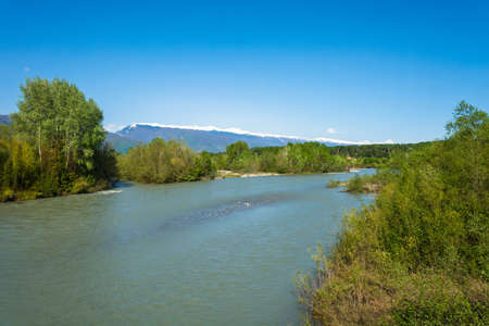 Bzpi mountain river on a background of snow mountains, Abkhazia. の写真素材