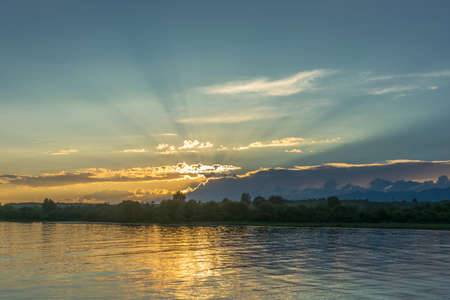 A beautiful sunset on lake Issyk-Kul in the quiet summer evening, Kyrgyzstan.の写真素材