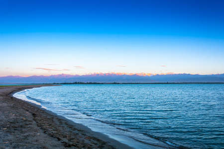 A quiet evening at Lake Issyk-Kul near Pier-Karakol, Kyrgyzstan.の写真素材