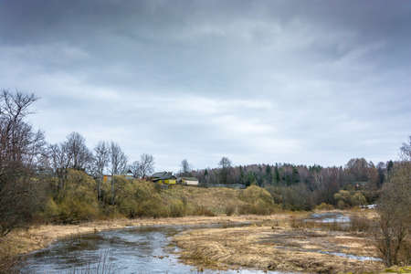 Rural landscape in a cloudy spring day. April, Russia.の写真素材