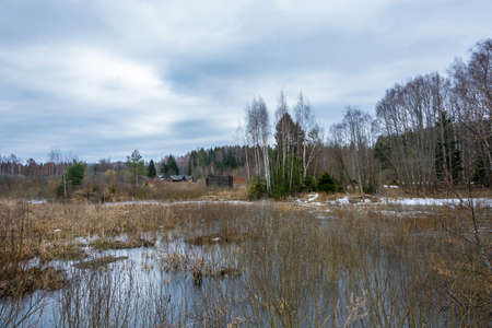 Rural landscape in a cloudy spring day. April, Russia.の写真素材